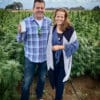 Founders Holding Blissful Plant Box in Hemp Field