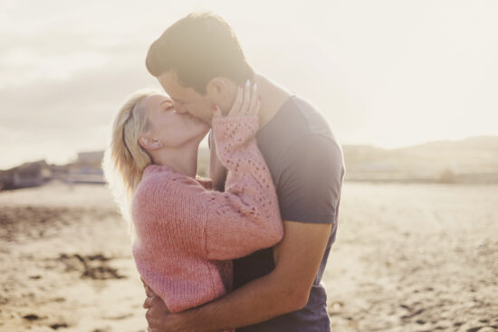 Couple Kissing on Beach